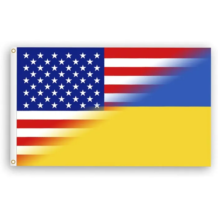A flag split diagonally between the American flag (stars and stripes) and the Ukrainian flag (blue and yellow), with brass grommets on a white background